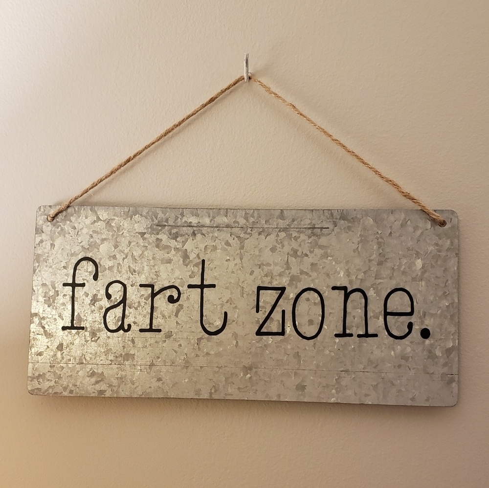 "Fart zone." Bathroom humor sign
